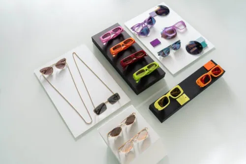 Colorful sunglasses collection from Kering Eyewear on display.